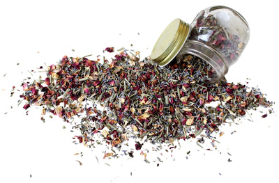 Hair Addicct Quench Me Herbal Hair Tea displayed with dried botanical herbs on a clean white background, showcasing its hydrating and growth-promoting properties.